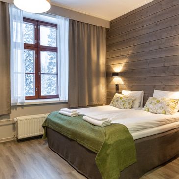 a hotel room with a double bed